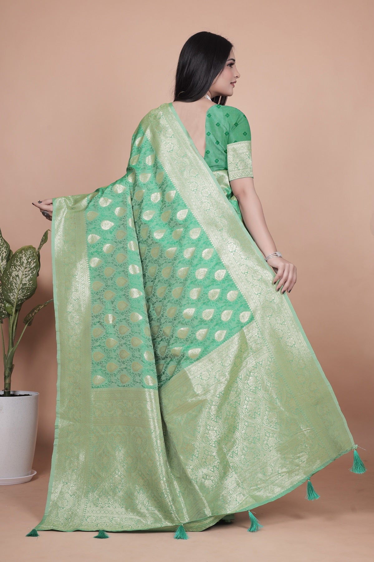 Elegant Green Banarasi Silk Saree with Golden Zari Work & Tassel Border