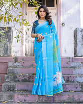 Elegant Sky Blue Linen Saree with White Lotus Print & Silver Zari Border