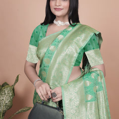 Elegant Green Banarasi Silk Saree with Golden Zari Work & Tassel Border