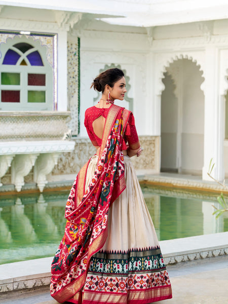 Glamgait Cream Patola Lehenga Choli with Red Banarasi Dupatta