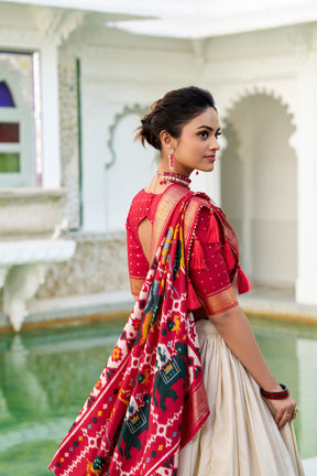 Glamgait Cream Patola Lehenga Choli with Red Banarasi Dupatta