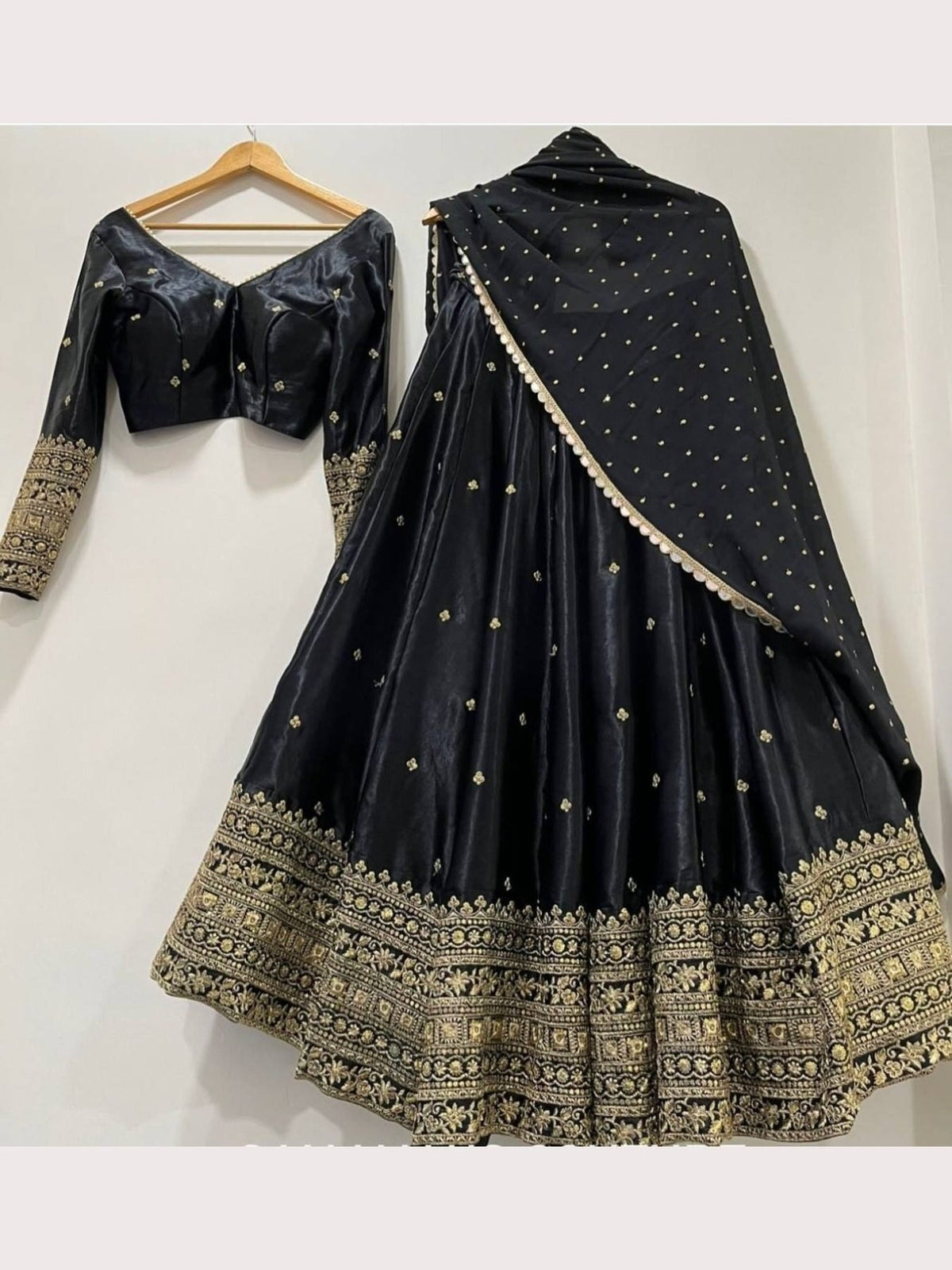 Elegant Black Silk Lehenga Choli with Heavy Gold Embroidered Border & Dupatta